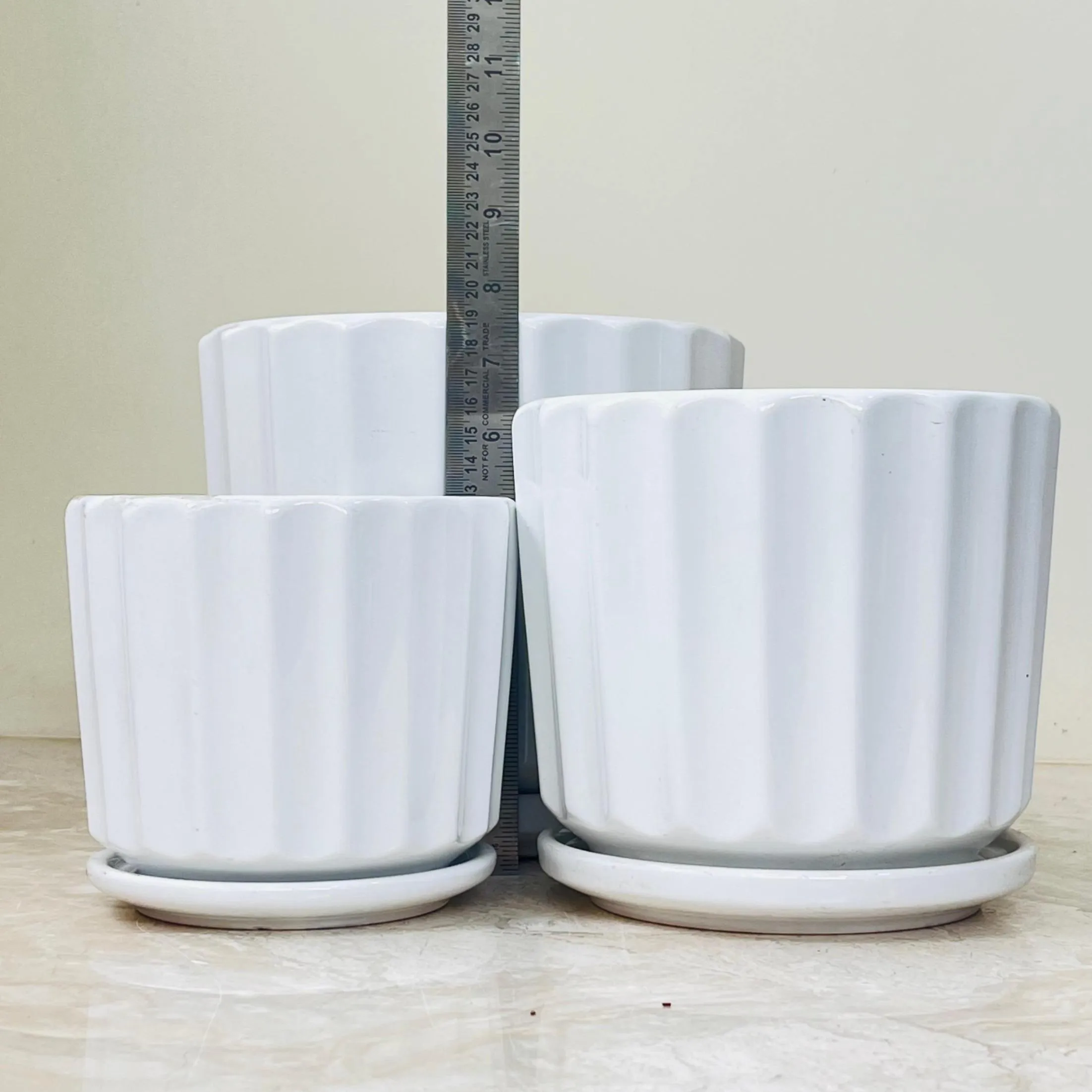 White Sculpted Ceramic Pot Set with Saucers (Set Of 3)